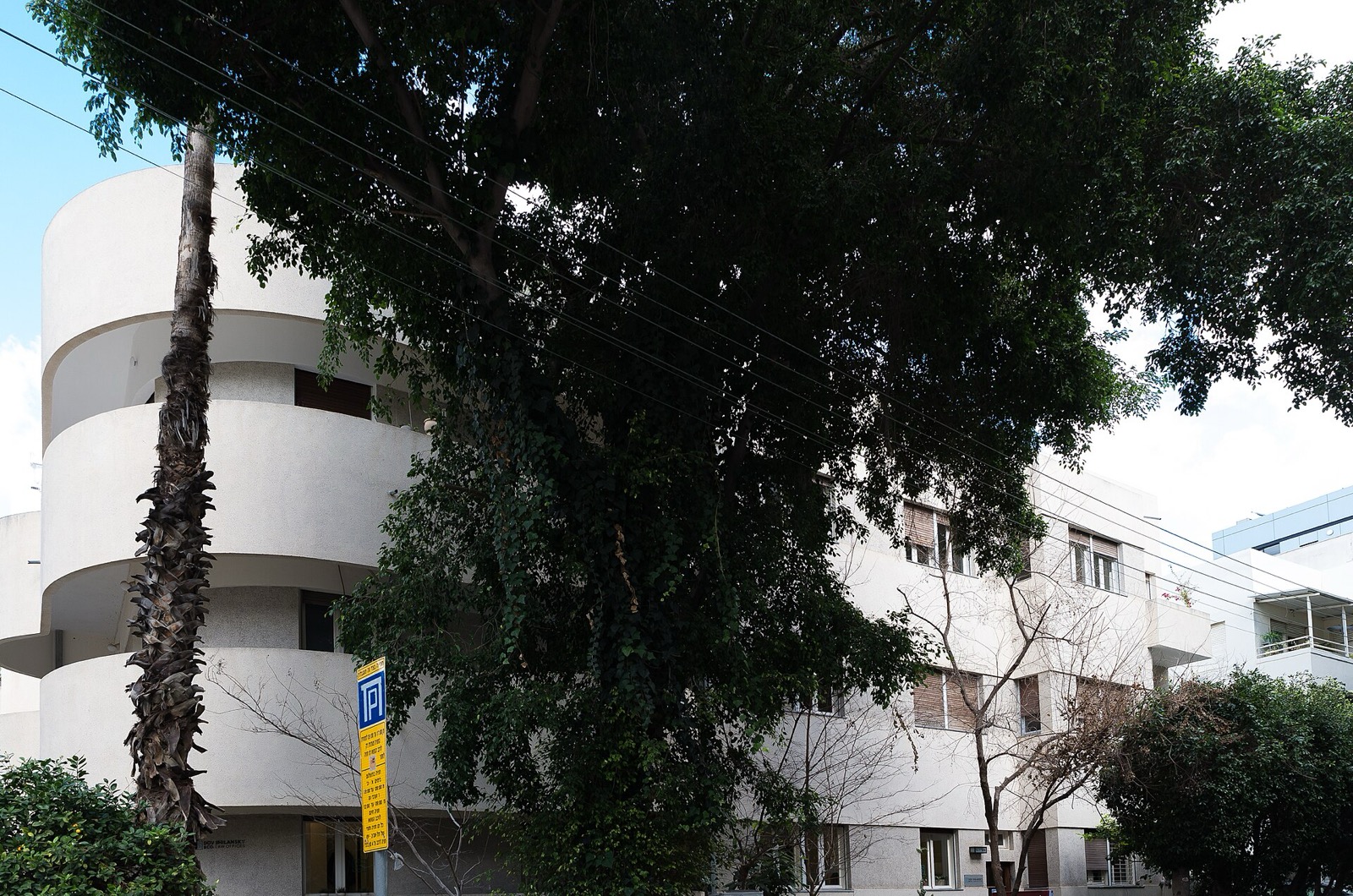Beit Dolphiner on Yehuda HaLevi Street, its rounded corner rising through four storeys