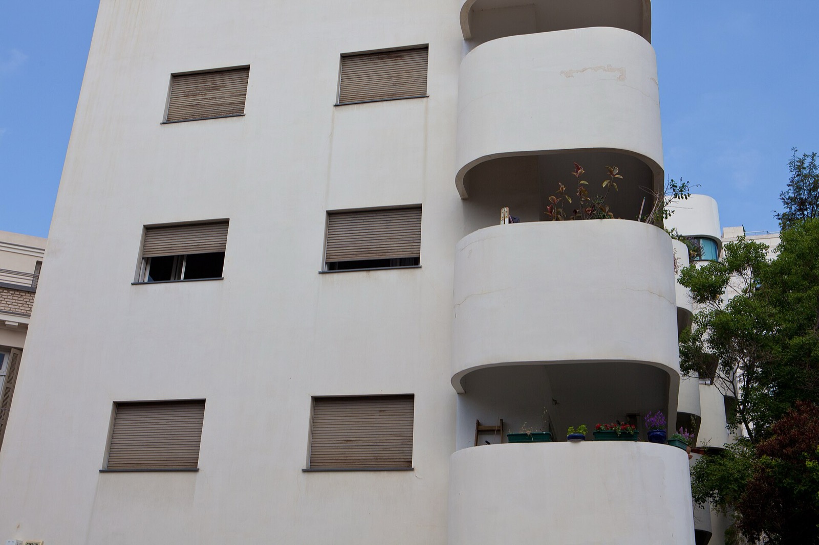 A White City building with curved balconies